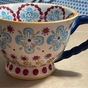 Four beautiful anthropologie ceramic mugs.
